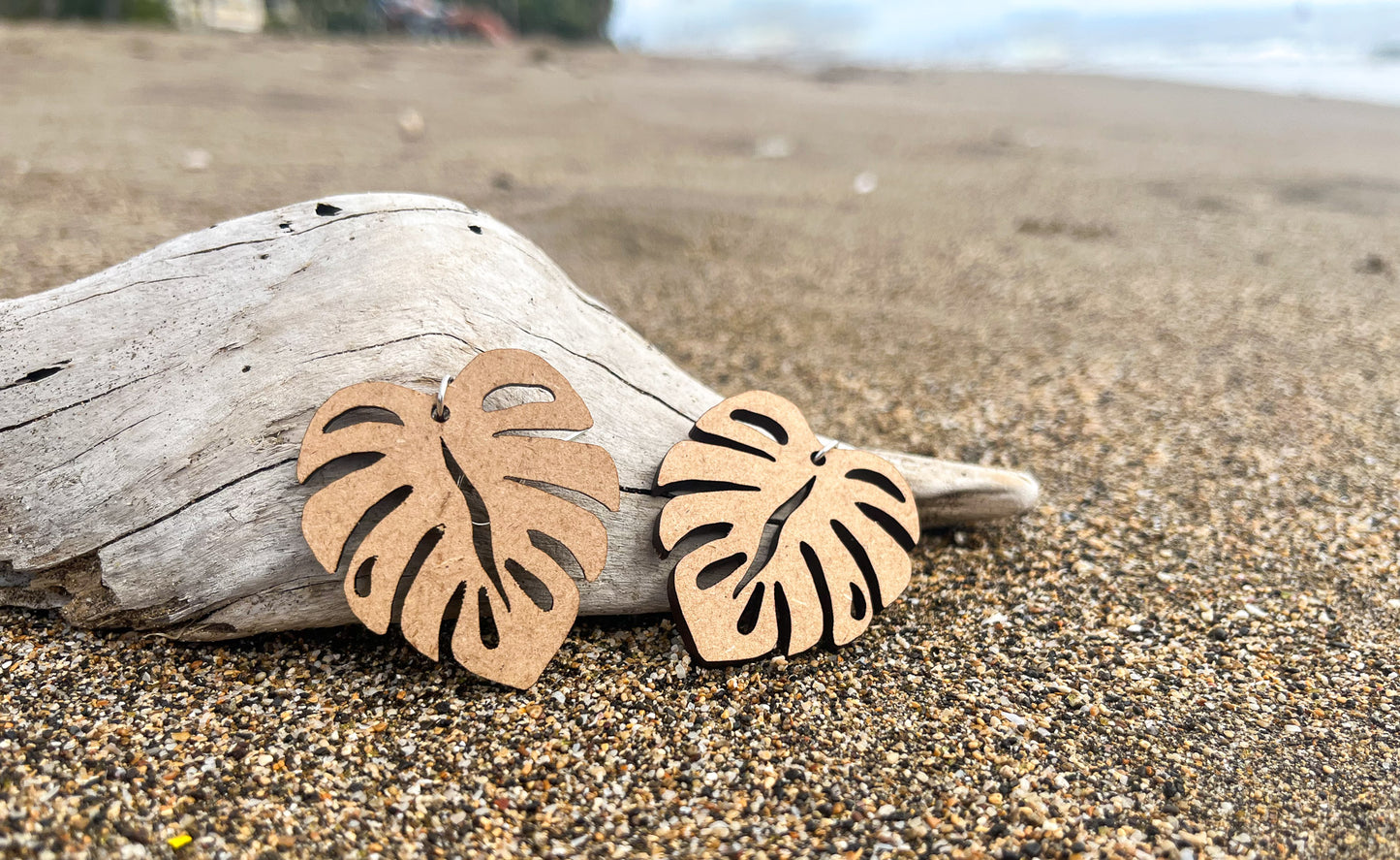 Wooden Earrings in the shape of a Monstera leaf. Approximately 1.5" x 1.6"