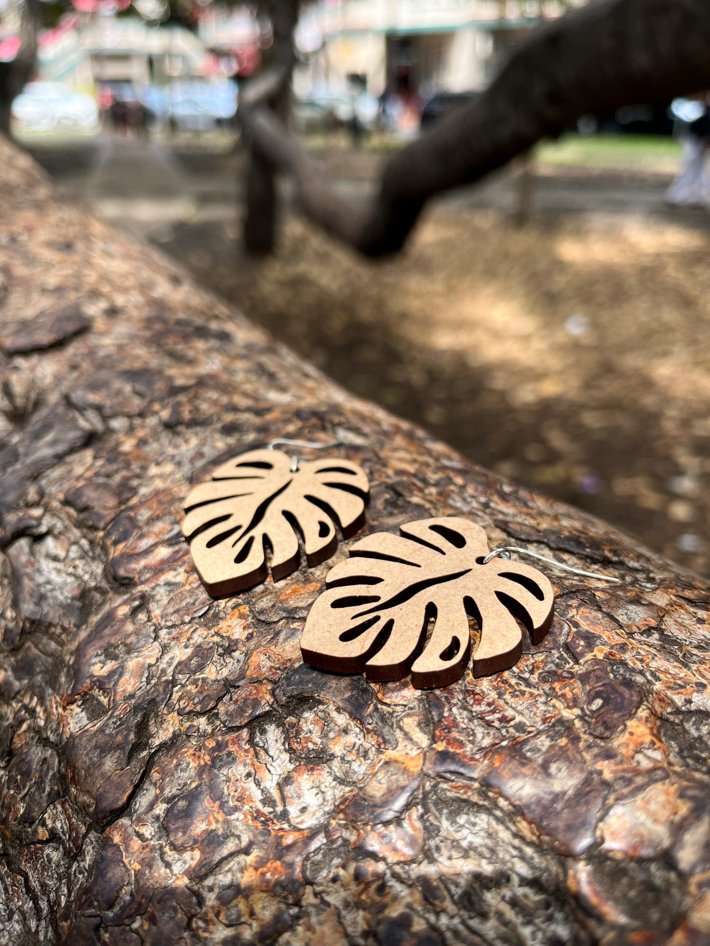 Wooden Earrings in the shape of a Monstera leaf. Approximately 1.5" x 1.6"