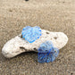 Blue Acrylic Earrings in the shape of a Monstera leaf. Approximately 1.5" x 1.6"