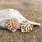 Wooden Earrings in the shape of a Monstera leaf. Approximately 1.5" x 1.6"
