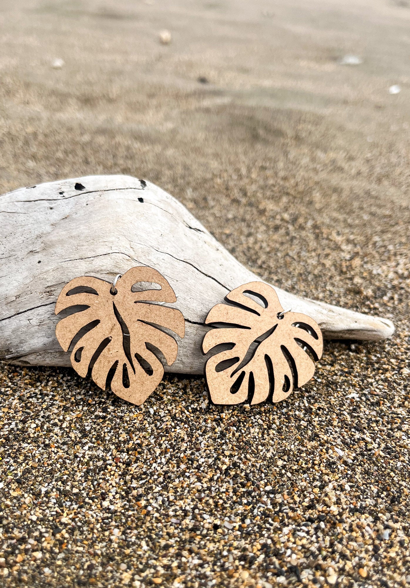Wooden Earrings in the shape of a Monstera leaf. Approximately 1.5" x 1.6"